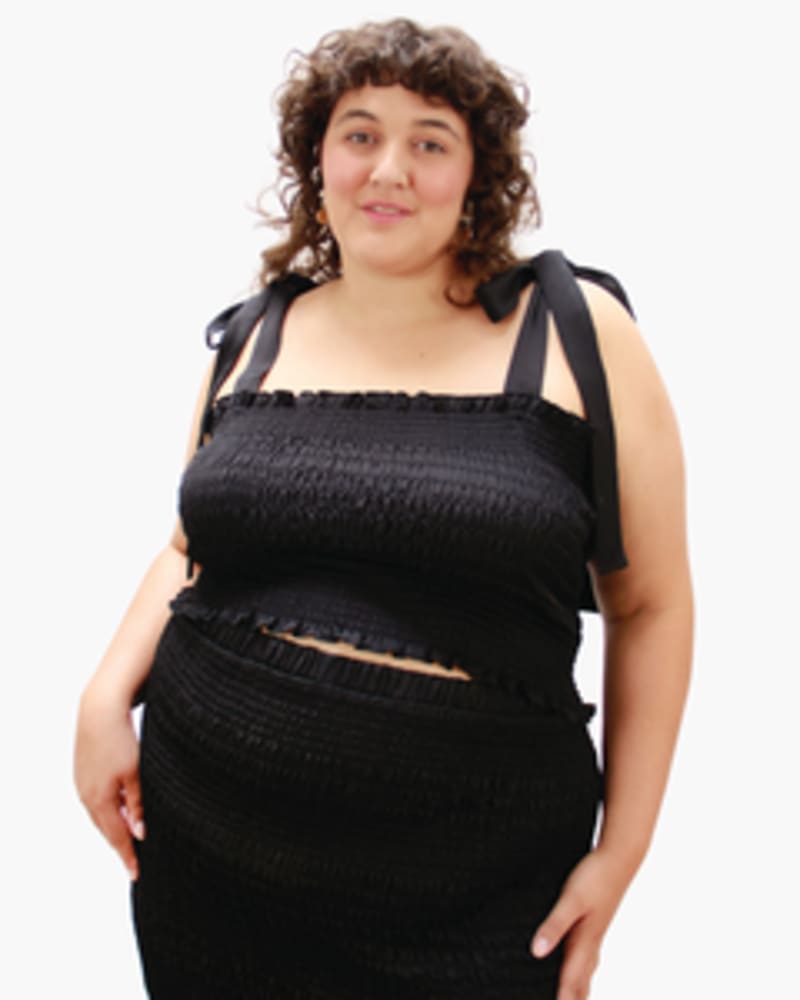 Front of a model wearing a size L Cinch Me Smocked Top in Black by Lovefool. | dia_product_style_image_id:249742